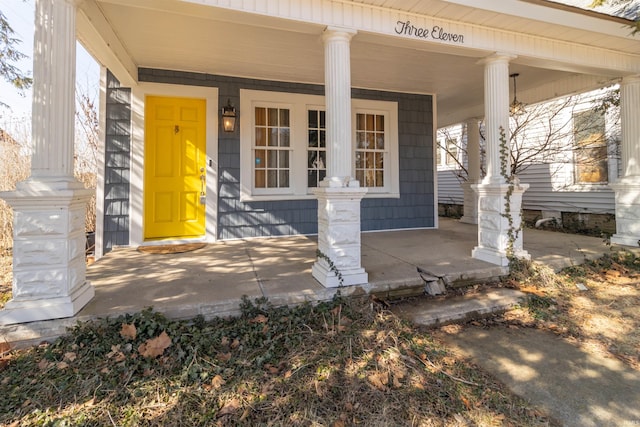 doorway to property featuring covered porch