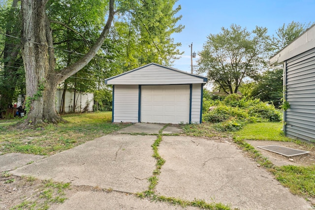 detached garage featuring driveway