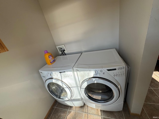 laundry room featuring washer and dryer and laundry area