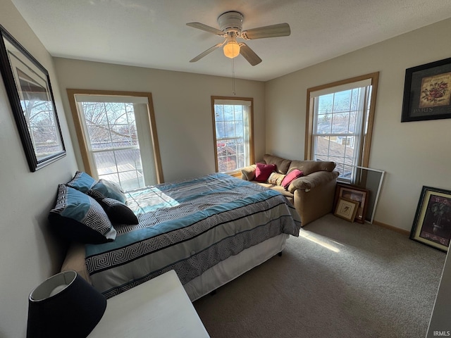 bedroom featuring ceiling fan, baseboards, and carpet flooring