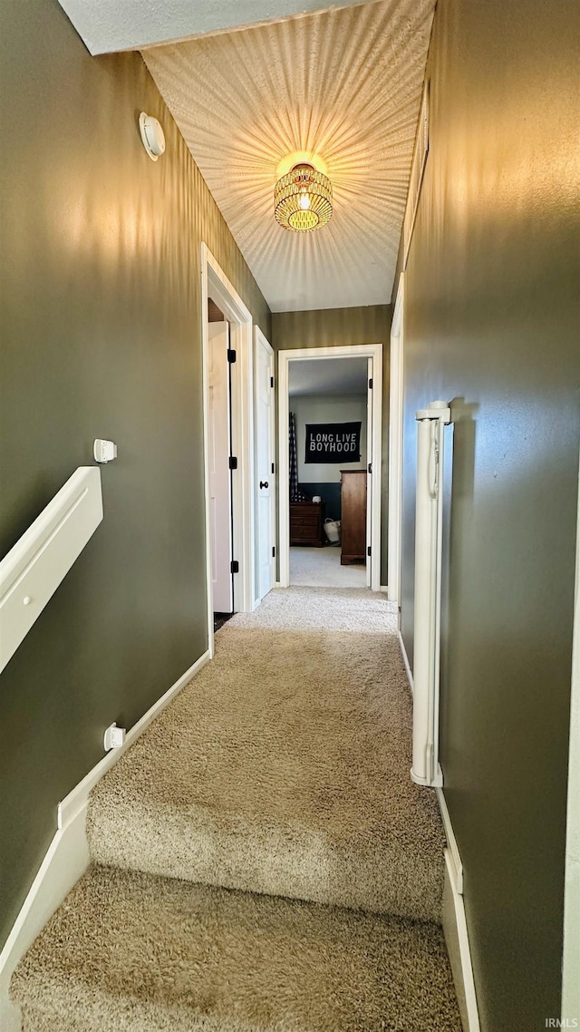 interior space with carpet floors and baseboards