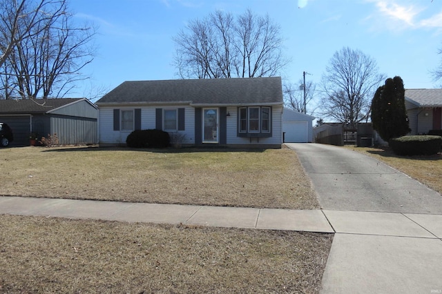 view of front of home with a garage and a front yard