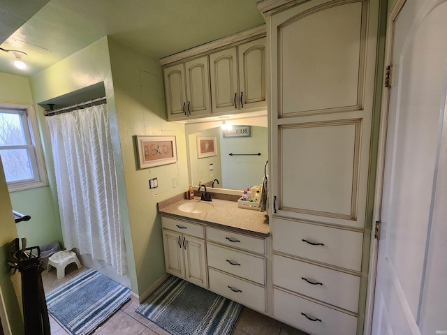 full bathroom featuring a shower with curtain, vanity, and tile patterned floors