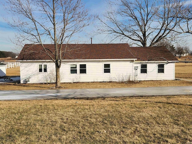 view of side of home featuring a lawn