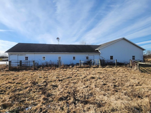 back of property featuring fence