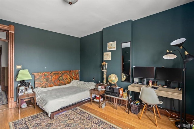 bedroom featuring hardwood / wood-style floors