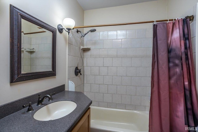 full bathroom featuring vanity and shower / tub combo with curtain