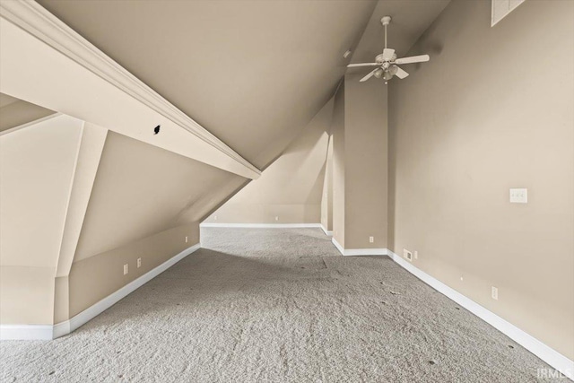 additional living space with carpet, ceiling fan, lofted ceiling, and baseboards