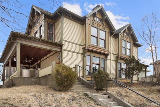 view of property exterior with a ceiling fan