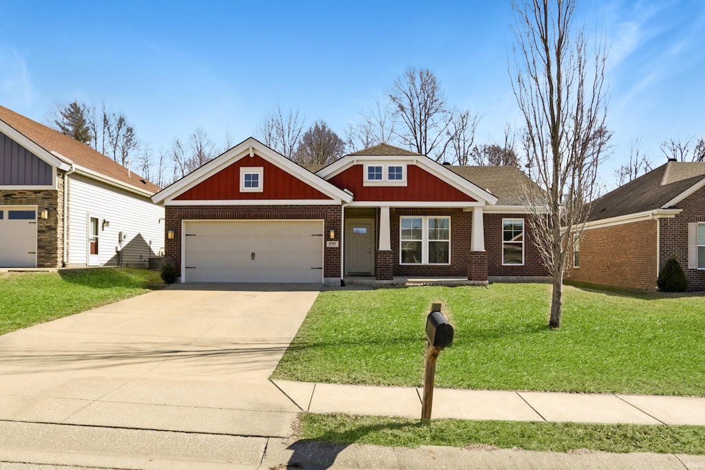 craftsman-style home featuring a garage, concrete driveway, brick siding, and a front lawn