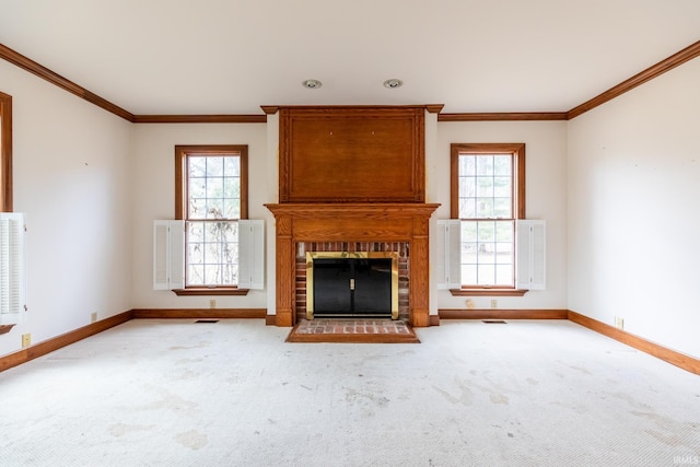 unfurnished living room featuring carpet, plenty of natural light, and baseboards