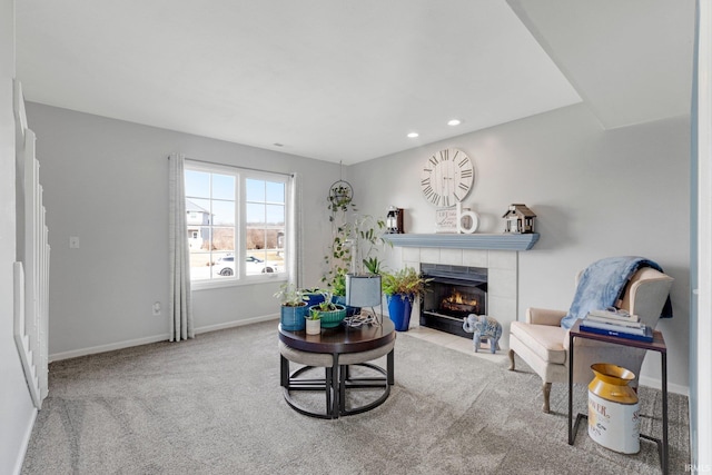 living area with recessed lighting, carpet, a tile fireplace, and baseboards