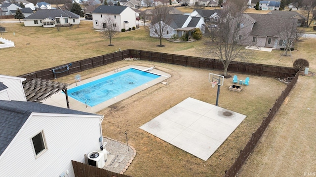 view of pool with a fenced backyard and a residential view