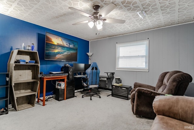 office space featuring carpet, an ornate ceiling, and a ceiling fan