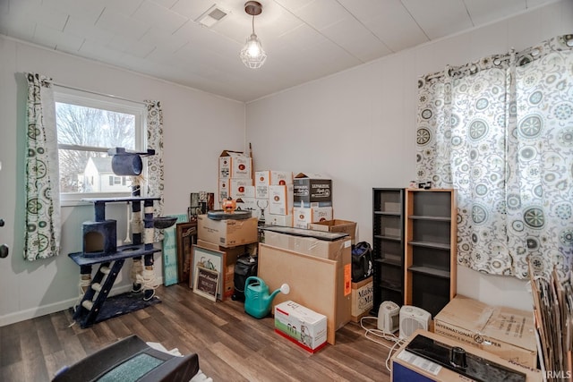 miscellaneous room with visible vents and wood finished floors