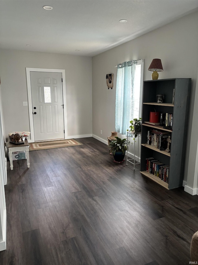 entrance foyer with baseboards, dark wood-type flooring, and recessed lighting