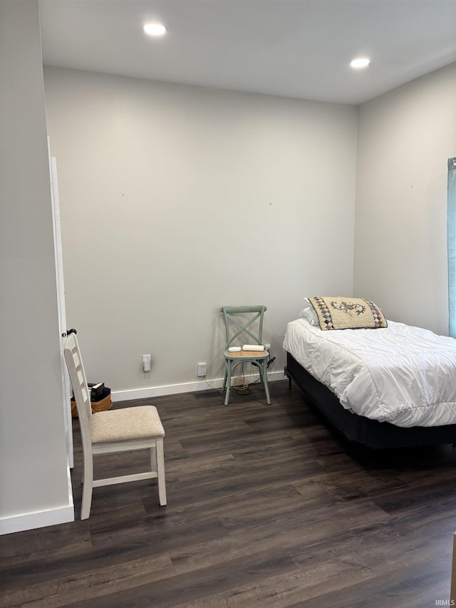 bedroom featuring dark wood-style floors, baseboards, and recessed lighting