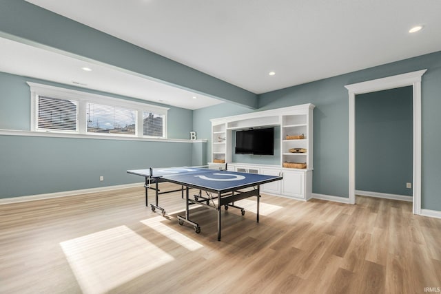 rec room with light wood finished floors, baseboards, beam ceiling, and recessed lighting