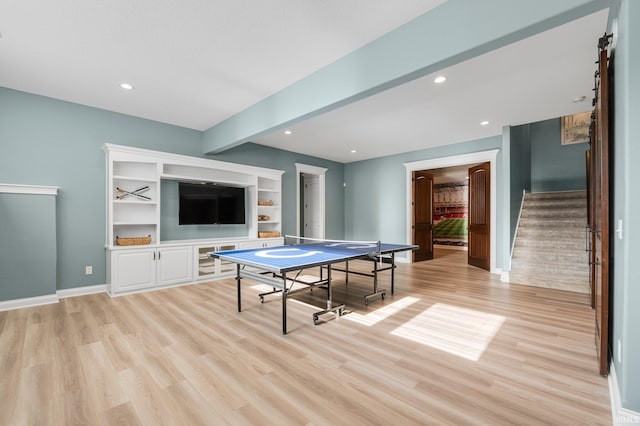 game room with light wood finished floors, beamed ceiling, recessed lighting, and baseboards