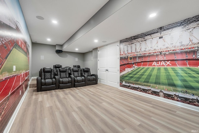 home theater with wood finished floors and recessed lighting