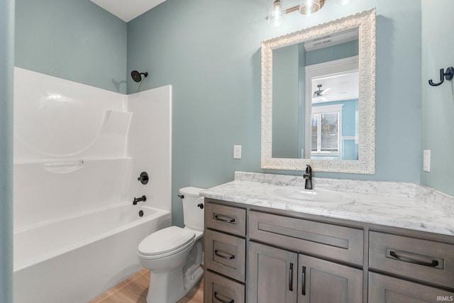 full bathroom featuring toilet, visible vents, shower / washtub combination, and vanity