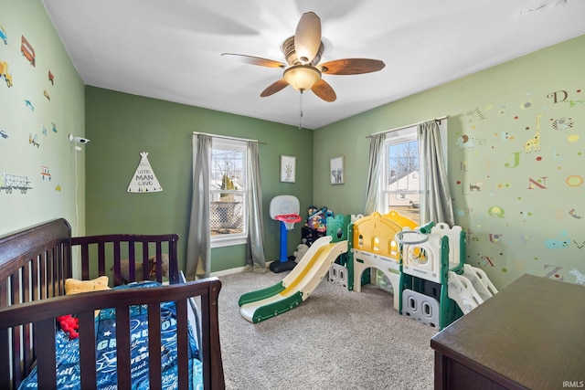 bedroom featuring carpet floors, a ceiling fan, and baseboards