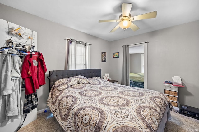 bedroom featuring a ceiling fan, carpet, and baseboards