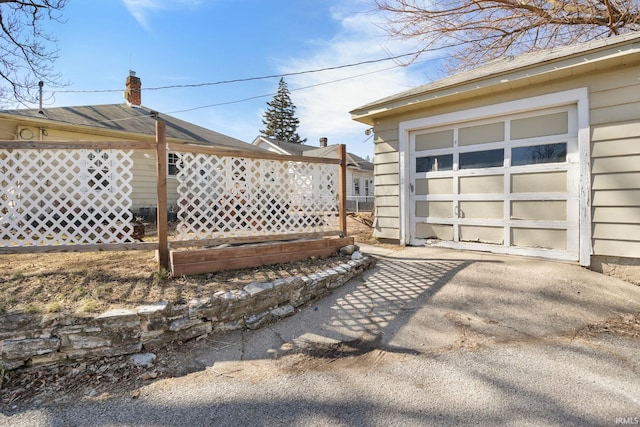 garage with concrete driveway