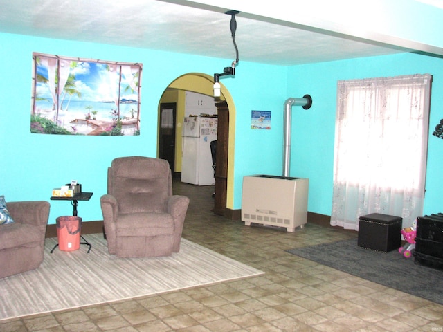 living room featuring arched walkways