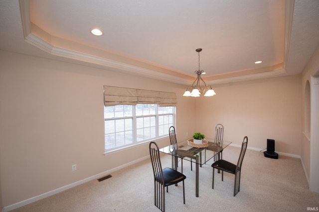 carpeted dining space with a notable chandelier, recessed lighting, a raised ceiling, visible vents, and baseboards