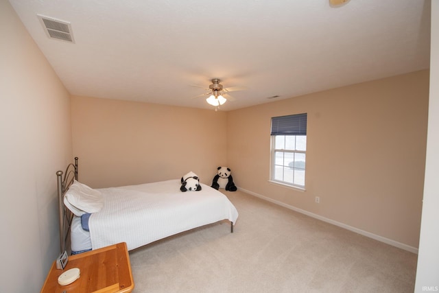 bedroom featuring light carpet, baseboards, visible vents, and ceiling fan