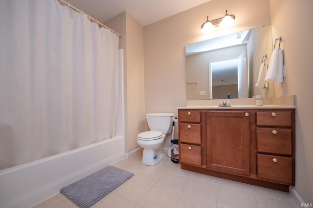 full bath featuring baseboards, toilet, shower / tub combo with curtain, tile patterned flooring, and vanity