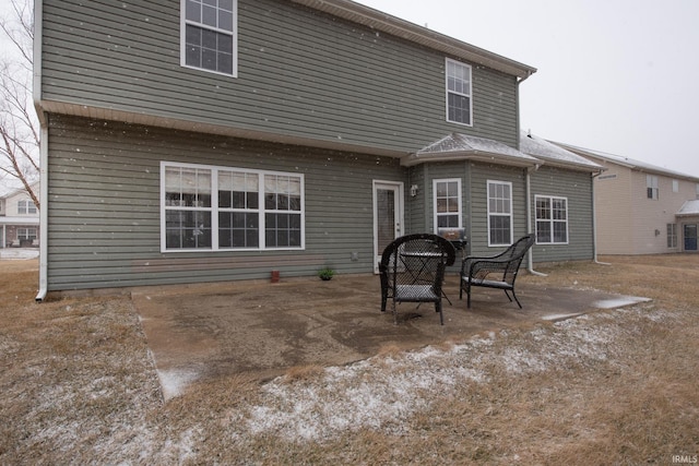 back of house with a patio