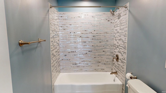 bathroom with shower / washtub combination and toilet