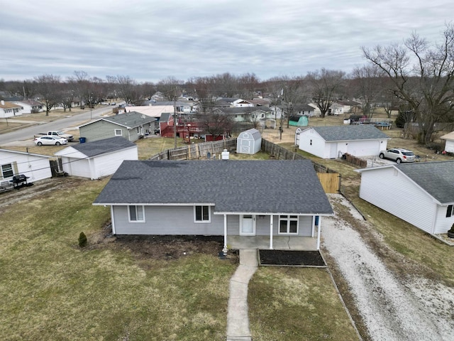 birds eye view of property with a residential view