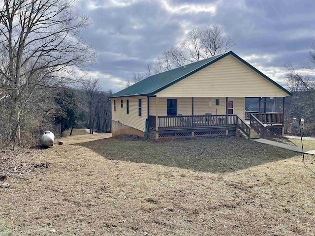 view of front of house featuring a porch and metal roof