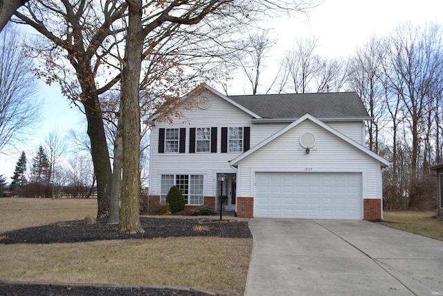 traditional-style home featuring an attached garage, driveway, a front lawn, and brick siding