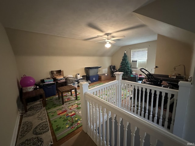 interior space featuring vaulted ceiling and ceiling fan