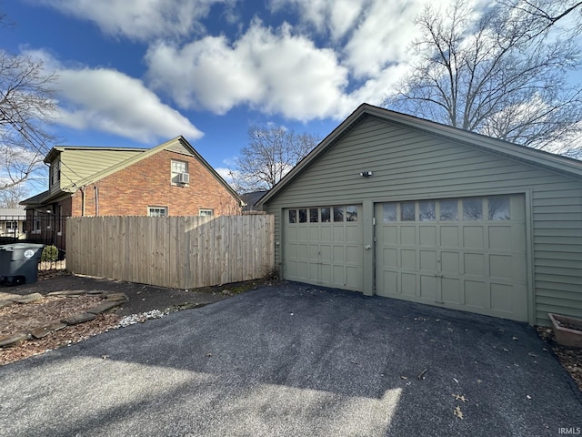 garage featuring fence