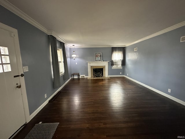 unfurnished living room with baseboards, a fireplace, ornamental molding, and wood finished floors