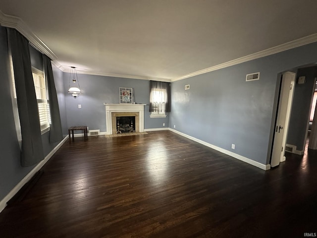 unfurnished living room with arched walkways, a fireplace, wood finished floors, visible vents, and baseboards