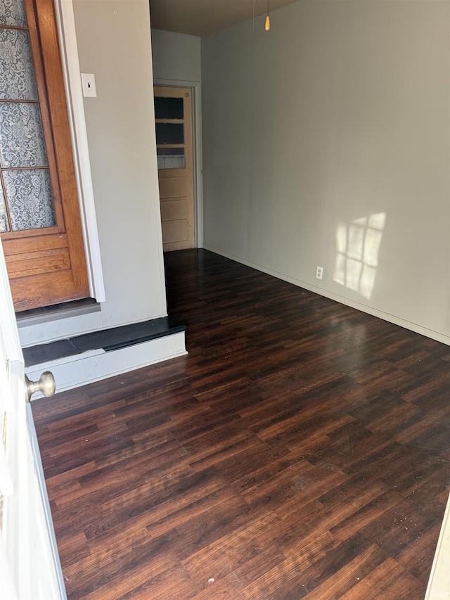 spare room with wood finished floors