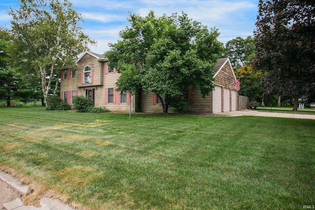 view of front of home featuring a garage and a front yard