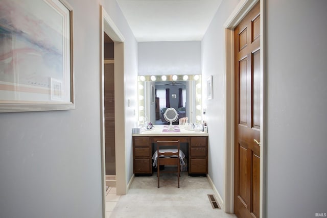 bathroom with visible vents, vanity, and baseboards