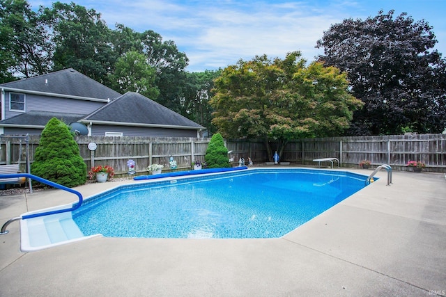 view of pool with a fenced backyard, a fenced in pool, and a patio