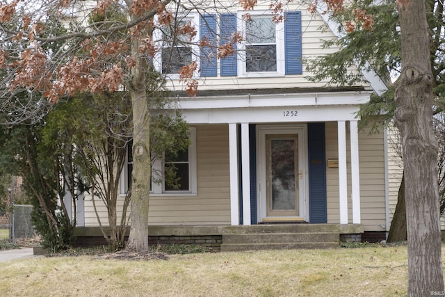 property entrance with a yard