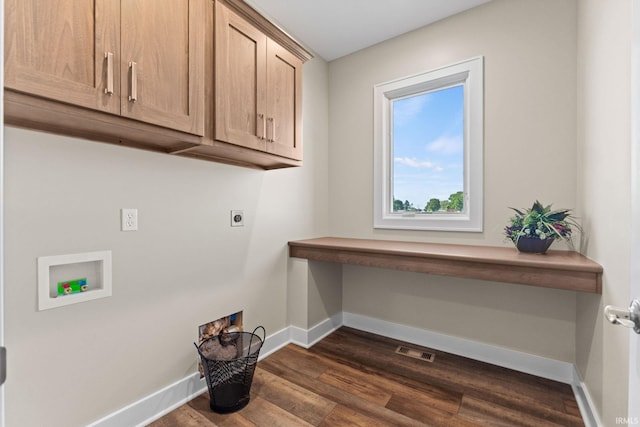 clothes washing area featuring cabinet space, baseboards, visible vents, dark wood-type flooring, and hookup for an electric dryer