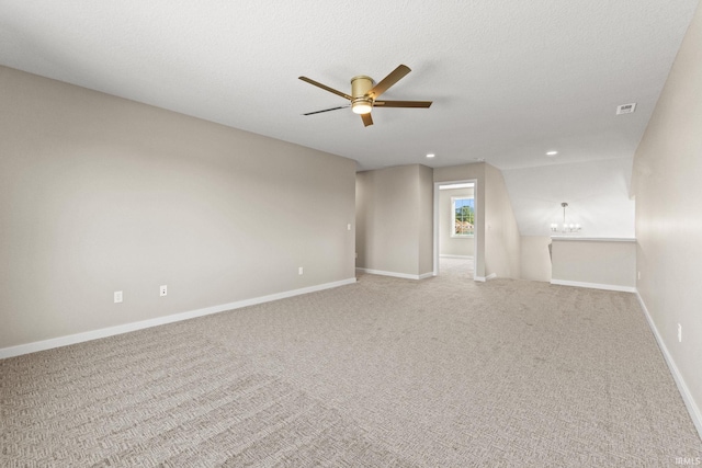 unfurnished room featuring baseboards, carpet, ceiling fan with notable chandelier, a textured ceiling, and recessed lighting