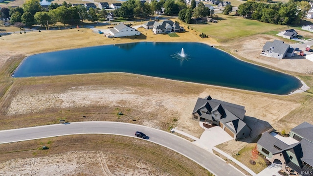 aerial view featuring a water view and a residential view