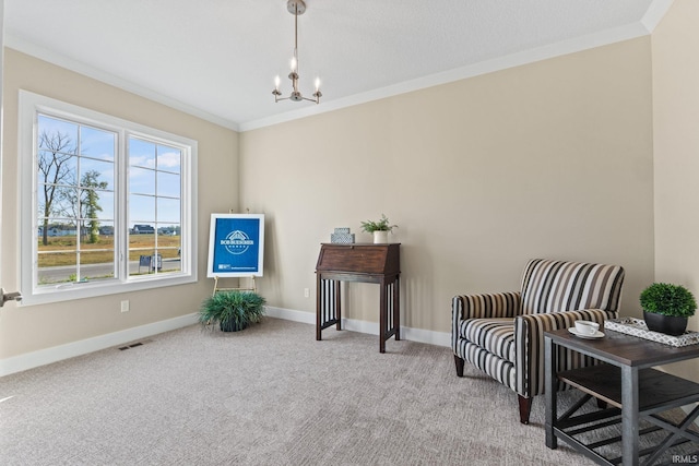 living area with baseboards, visible vents, ornamental molding, an inviting chandelier, and carpet